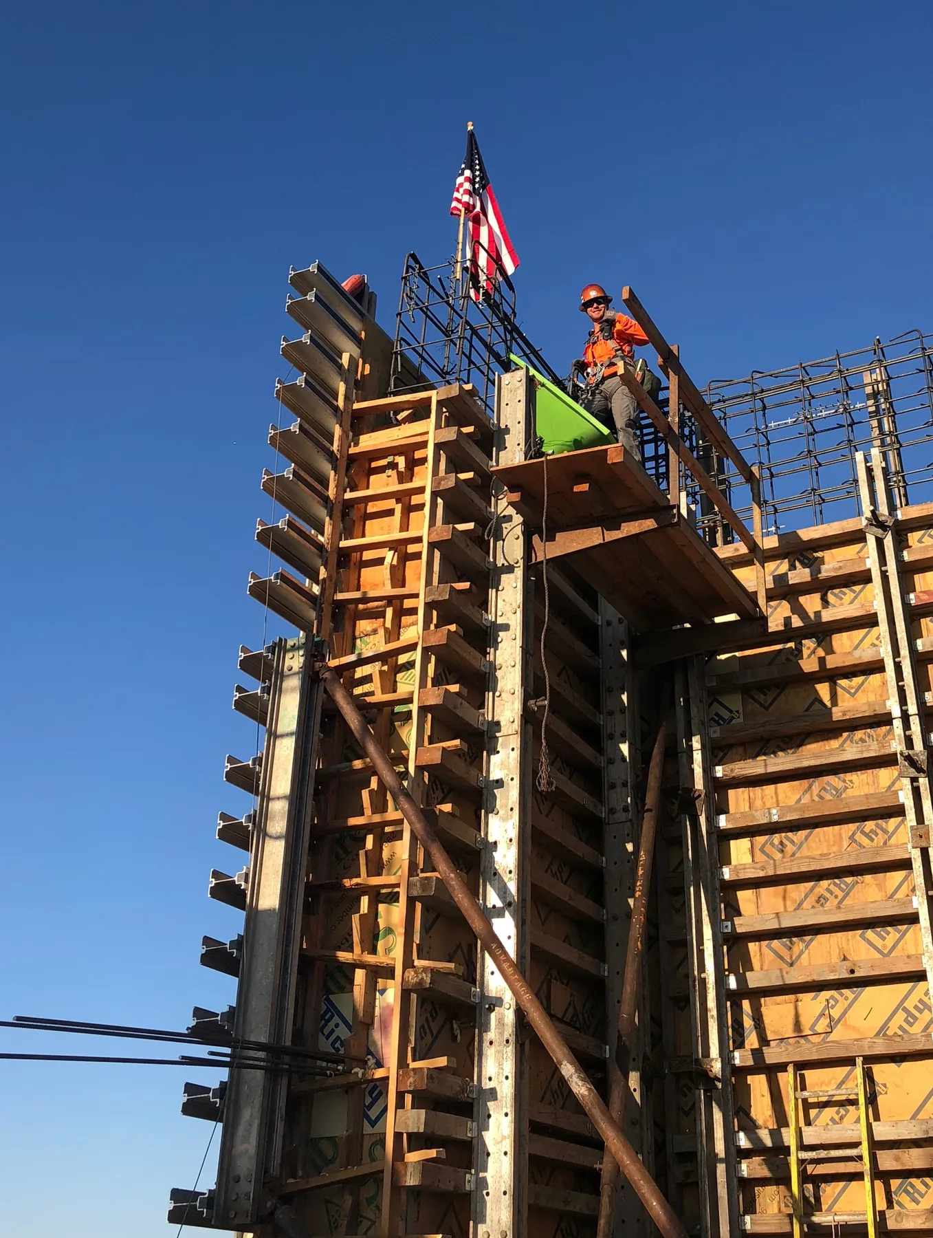 Colton Ray working on a commercial concrete wall form high above the ground in 2018