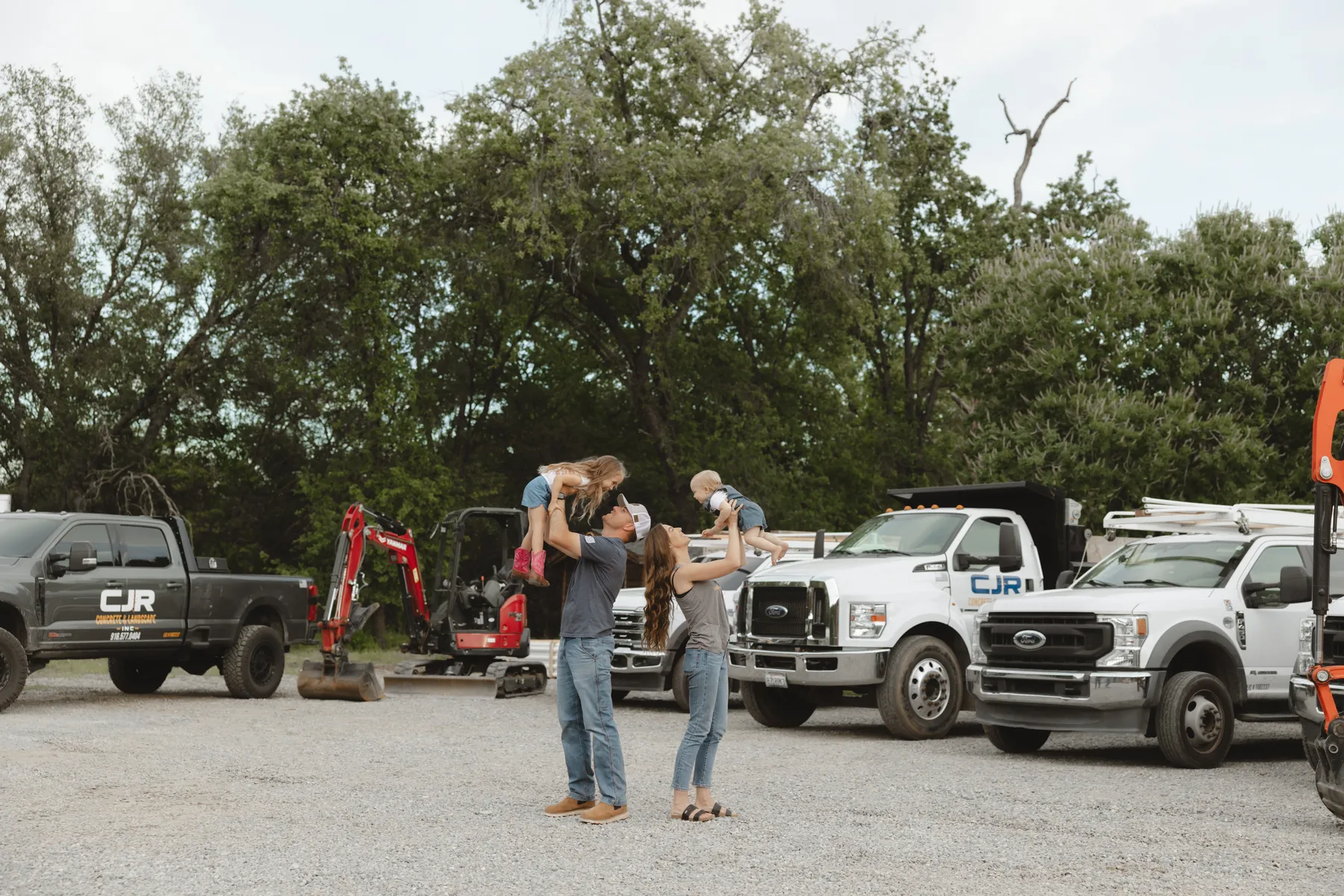 Colton Ray and his family with the CJR trucks and equipment