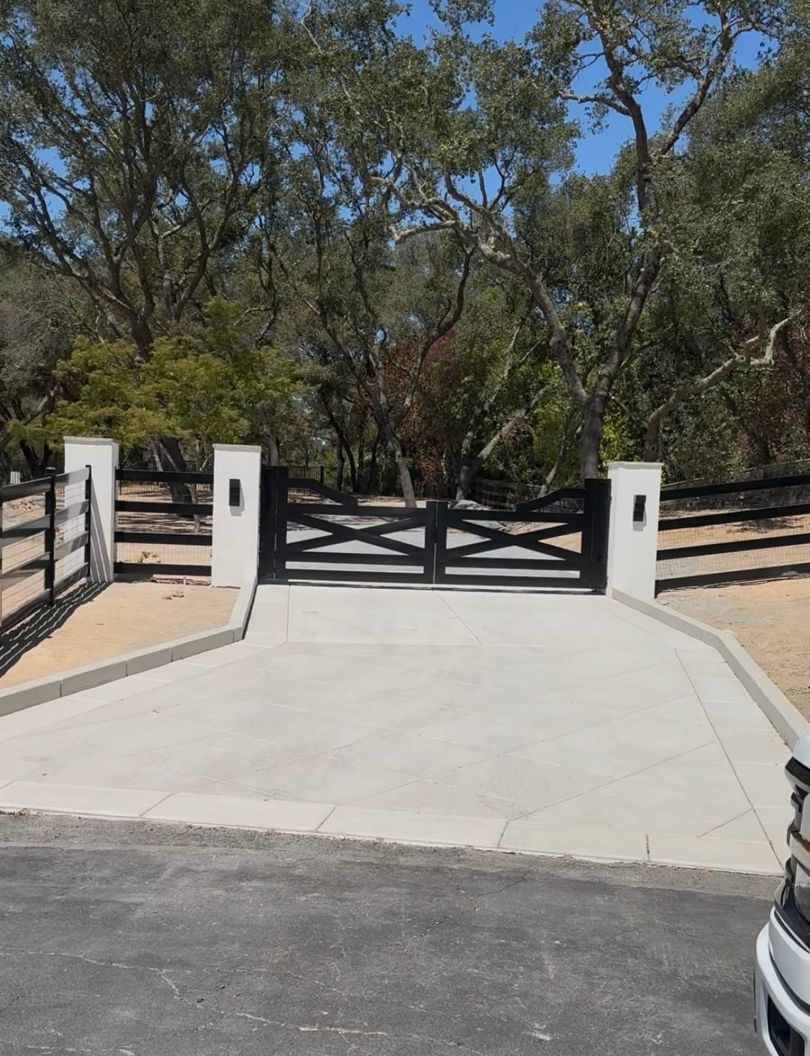 Decorative concrete driveway and pavers by CJR