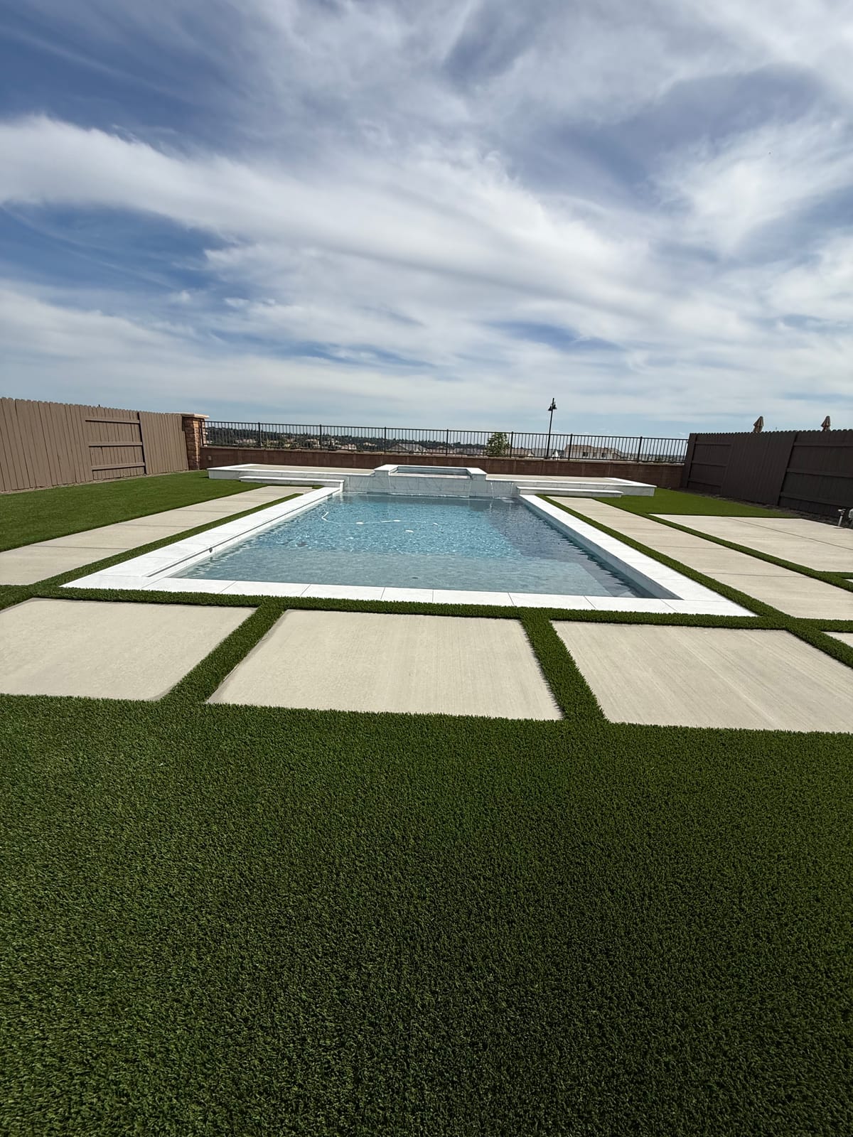 Outdoor living area with fire feature by CJR