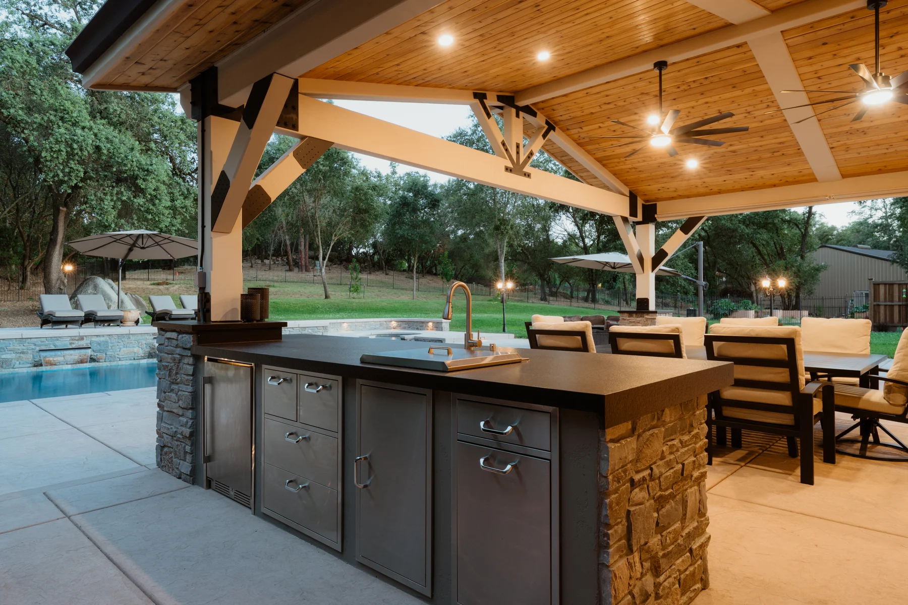 Covered outdoor kitchen and seating area