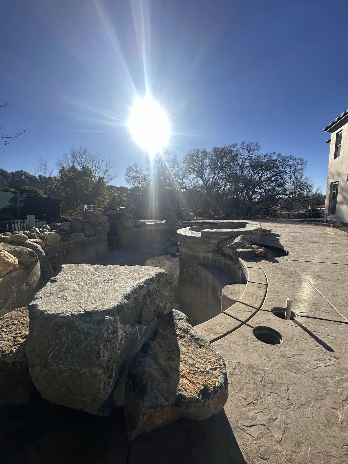 Masonry, stone, and tile phase of a CJR pool project